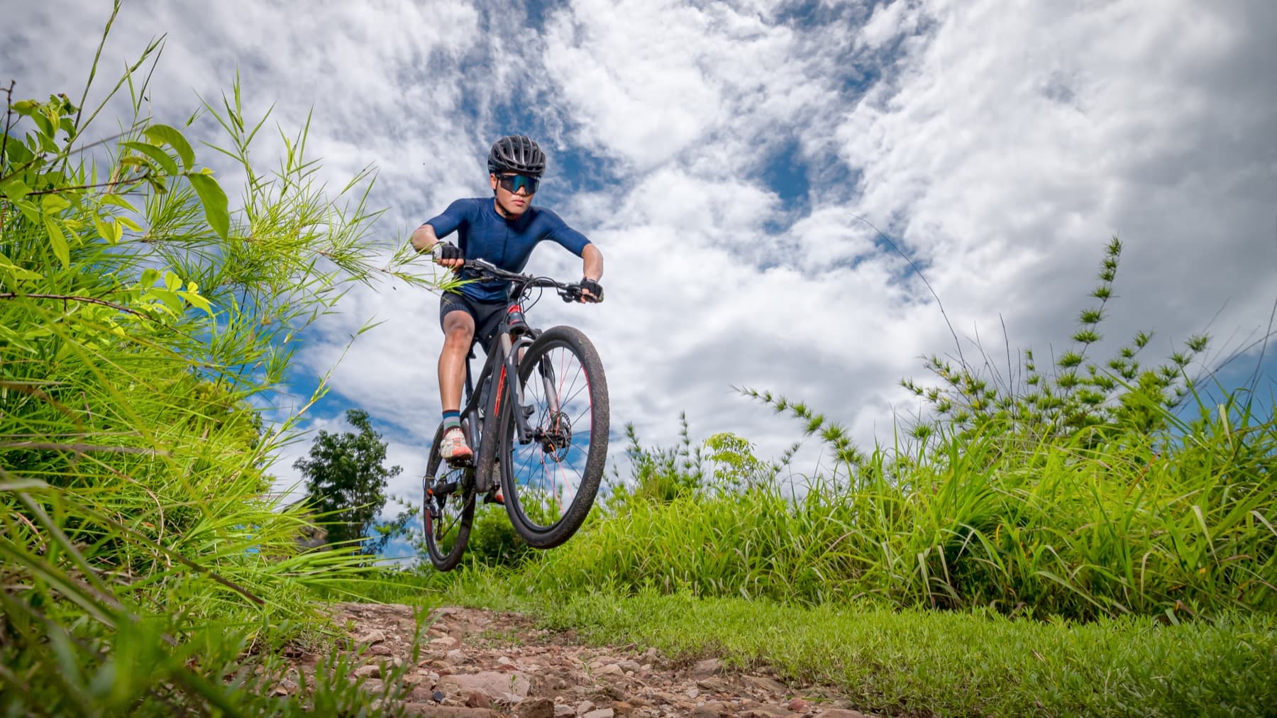 A mountain biker riding a cross-country race course